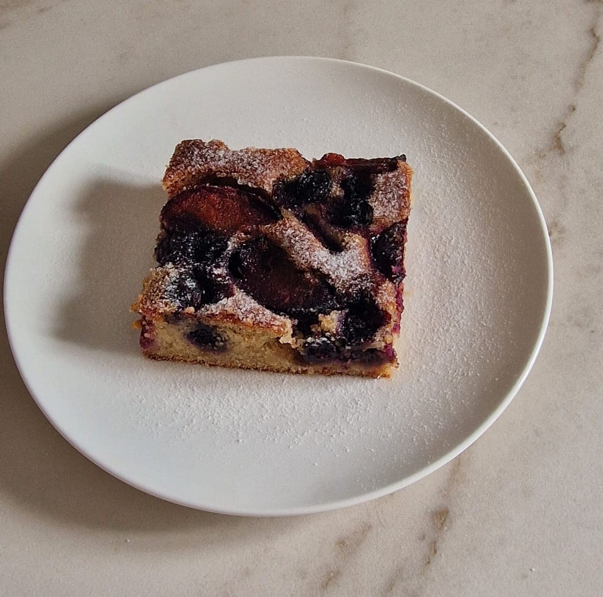 Almond, plum and blueberry bake, can be served with vanilla ice cream