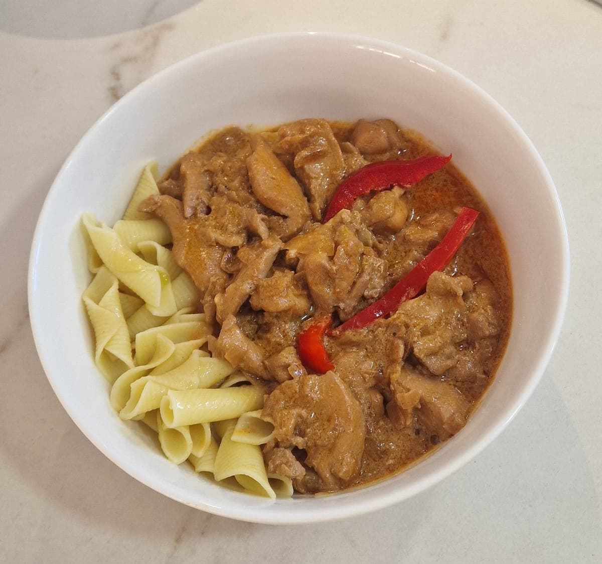 Chicken in creamy paprika sauce with a choice of pasta